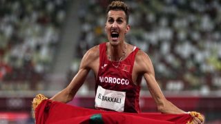Soufiane El Bakkali, of Morocco, celebrates after winning the men's 3,000-meter steeplechase final at the 2020 Summer Olympics, Monday, Aug. 2, 2021, in Tokyo. (AP Photo/Francisco Seco)